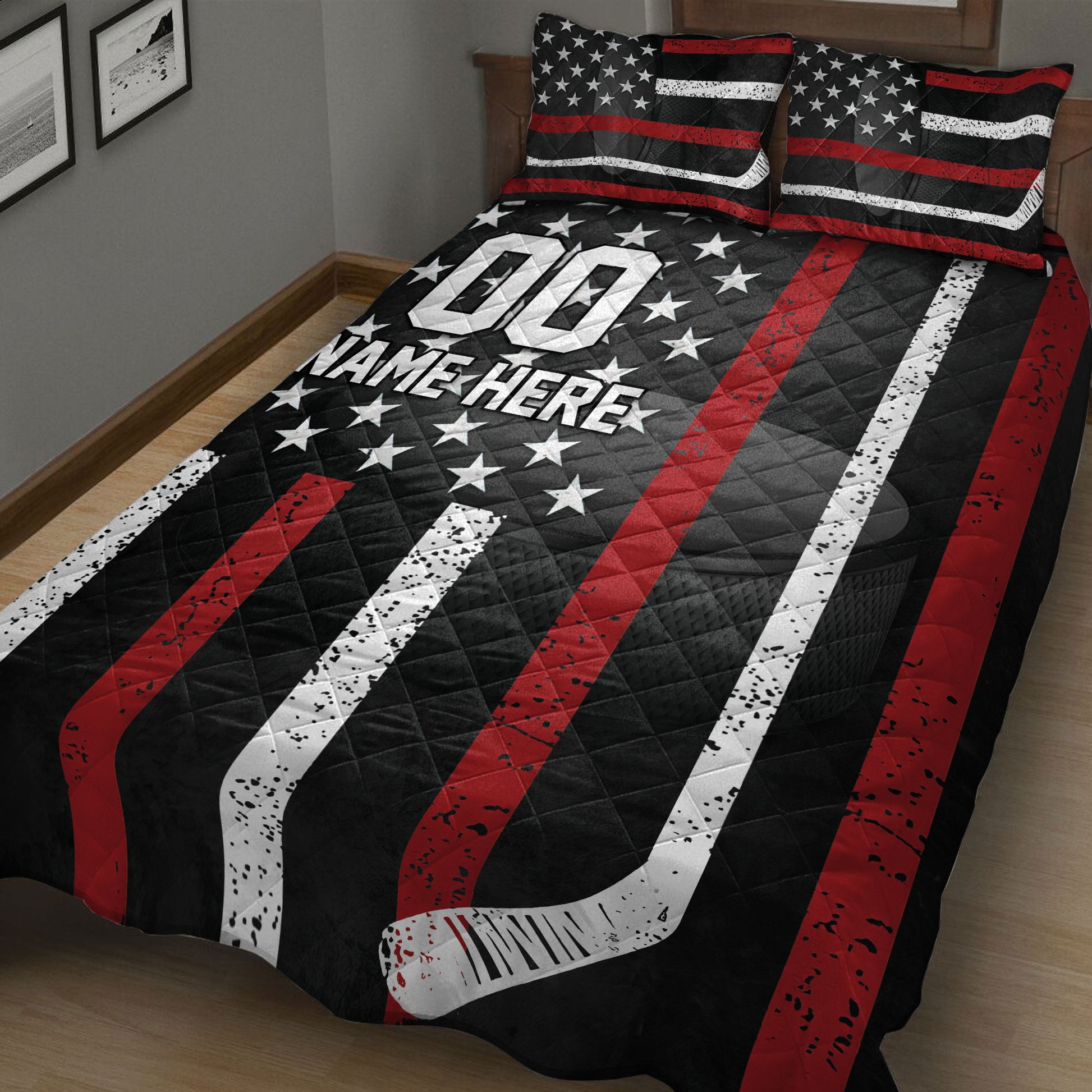 Close bedroom view of a hockey quilt blanket with stars, striped hockey stick artwork, and bold sports styling