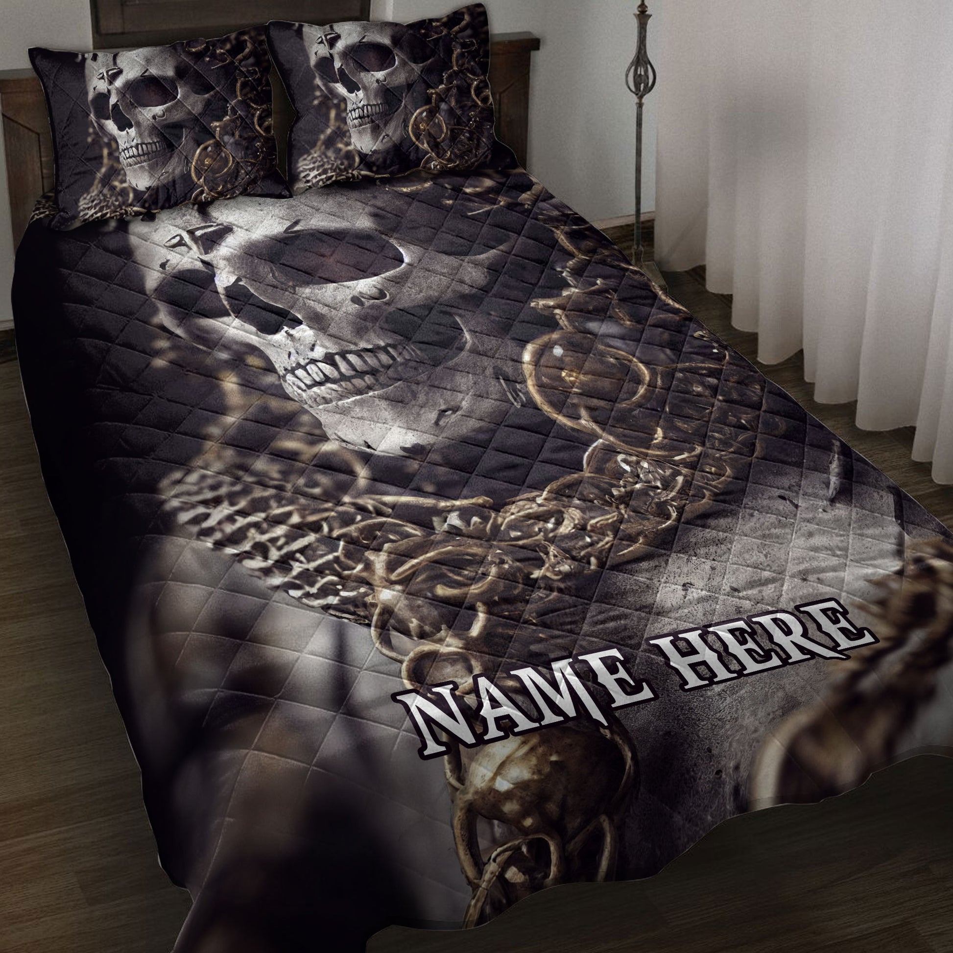 Skull quilt blanket spread across a bedroom with matching skull pillow designs in dark gothic tones