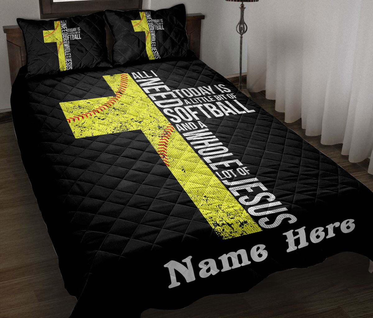Black softball quilt blanket styled on a bed with bold yellow softball artwork and sports typography
