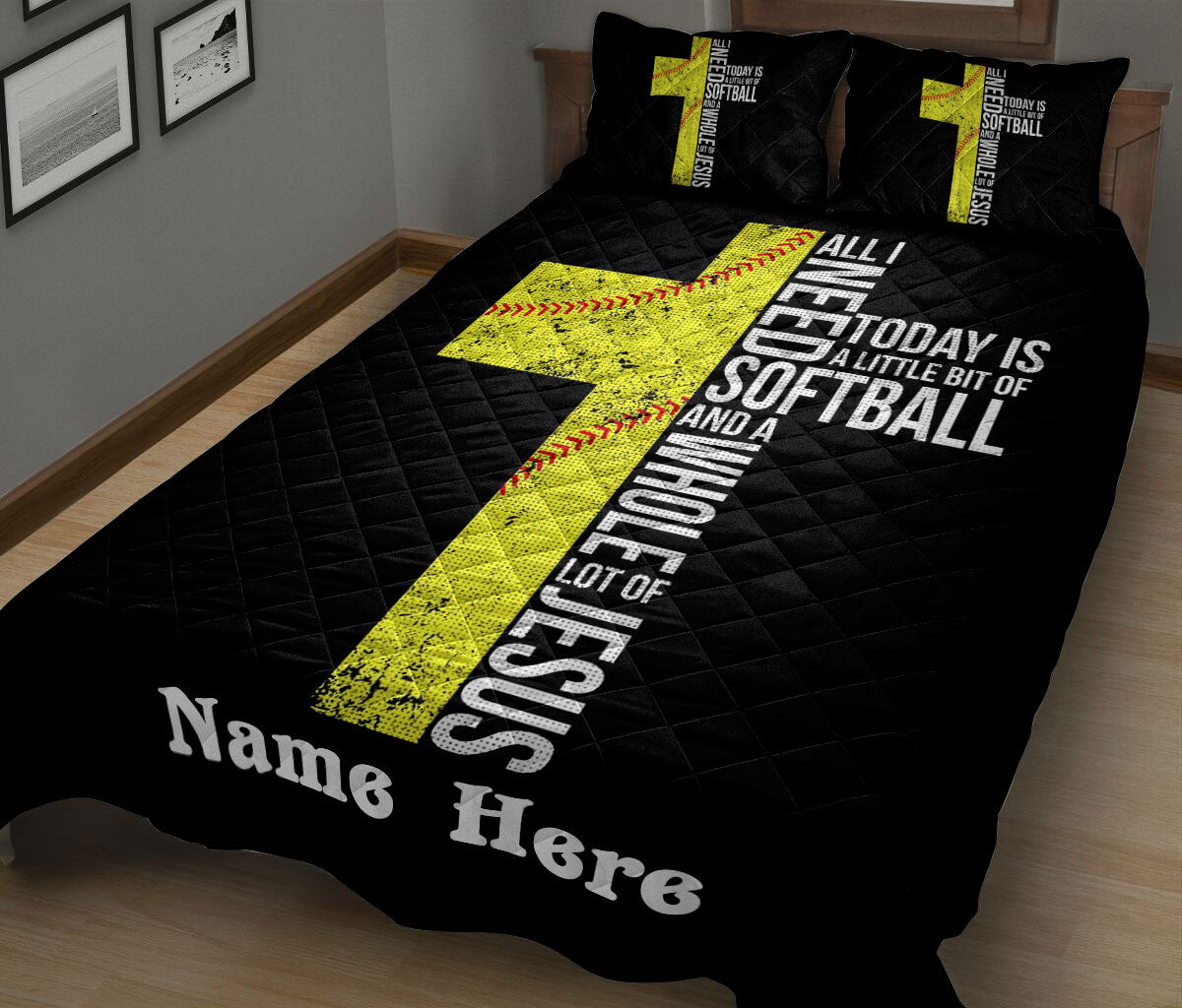 Black softball quilt blanket on a bed featuring yellow softball graphics and bold white typography