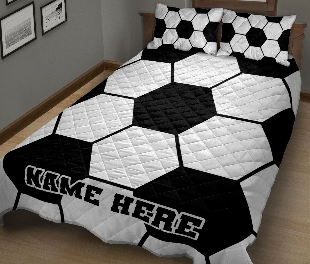 Soccer ball quilt blanket displayed on a bed in a modern black and white bedroom