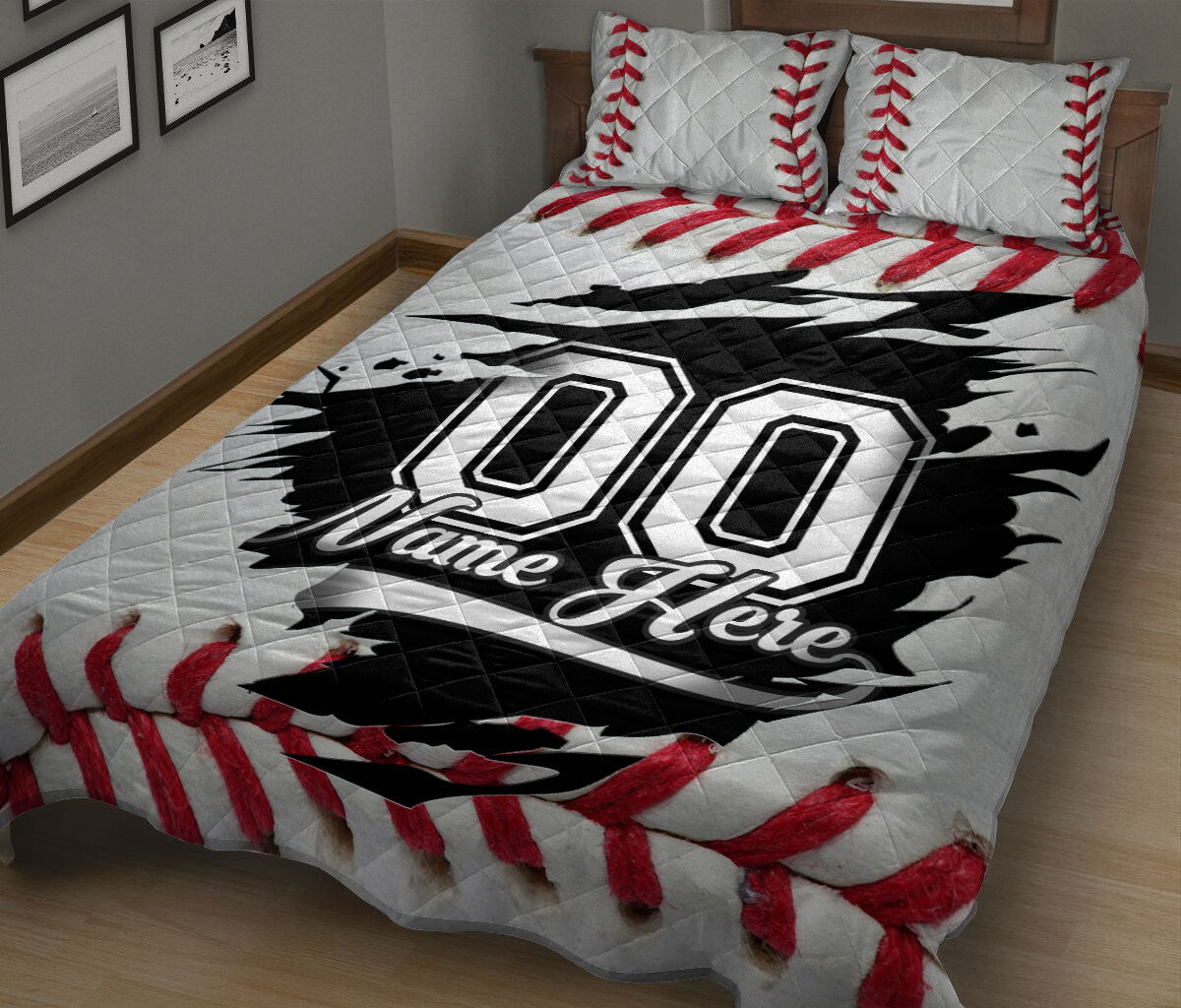 Baseball quilt blanket on a bedroom bed featuring red seam details and bold black athletic graphics