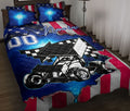 Dirt track racing quilt blanket displayed on a bed with a sprint car, checkered accents, and patriotic red, white, and blue artwork