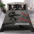 Baseball quilt blanket styled in a bright bedroom with dramatic batter artwork and red and black sports colors