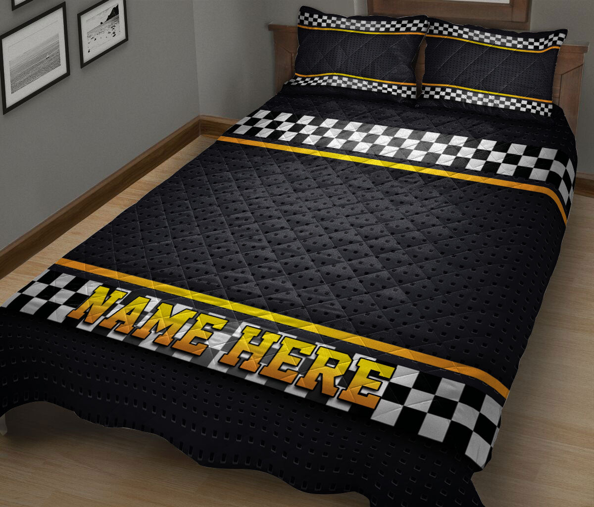 Black and yellow racing quilt blanket displayed on a bed with bold checkered flag artwork