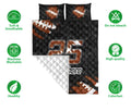 Football quilt bedding set shown with matching football artwork, quilted texture, and product feature icons