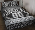 Custom racing quilt blanket displayed on a bed with checkered flags and bold black and gray motorsport artwork