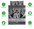 Racing quilt bedding set with checkered flags, bold racing graphics, and a black and gray bedroom design