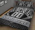 Black and gray racing quilt blanket featuring checkered flags and bold track-inspired bedroom artwork