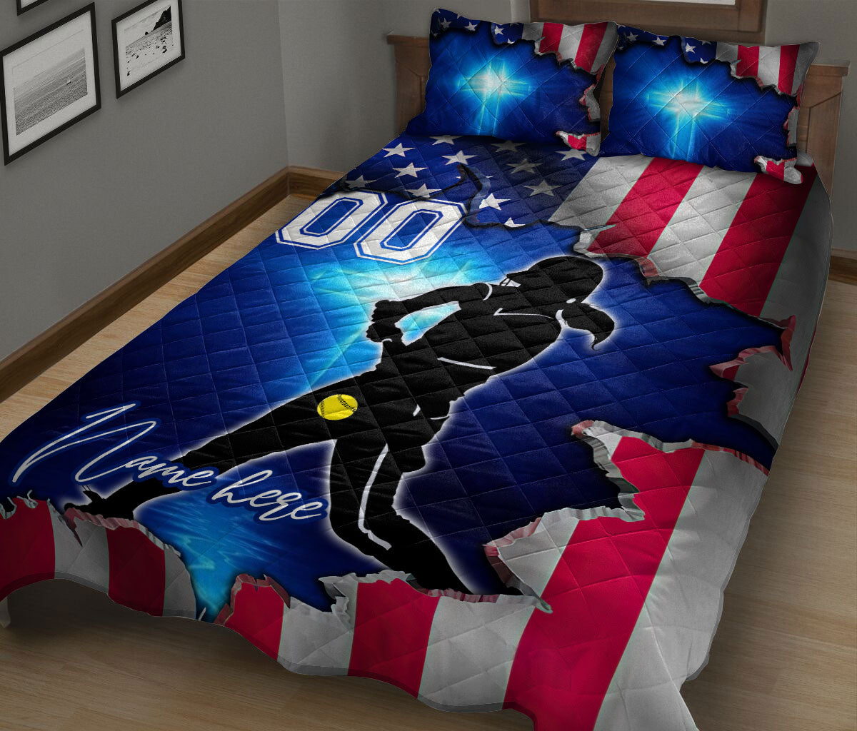 Patriotic softball quilt blanket displayed on a bed with female player silhouette and bright blue accents