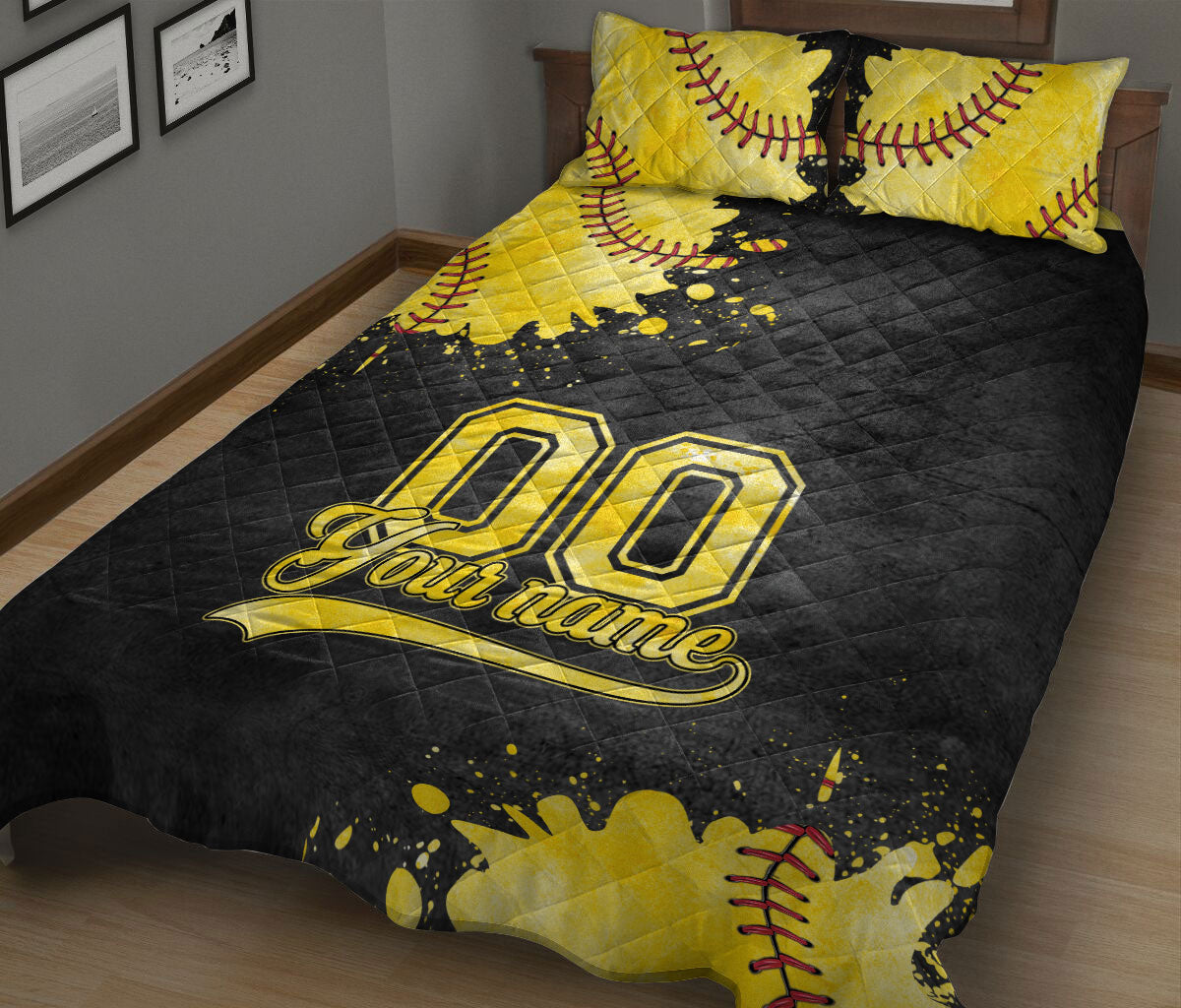 Bold black and gold softball quilt blanket with stitched ball artwork on a bed