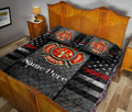 Firefighter quilt blanket styled in a bedroom with bold fire rescue emblem, stars, and red stripe artwork