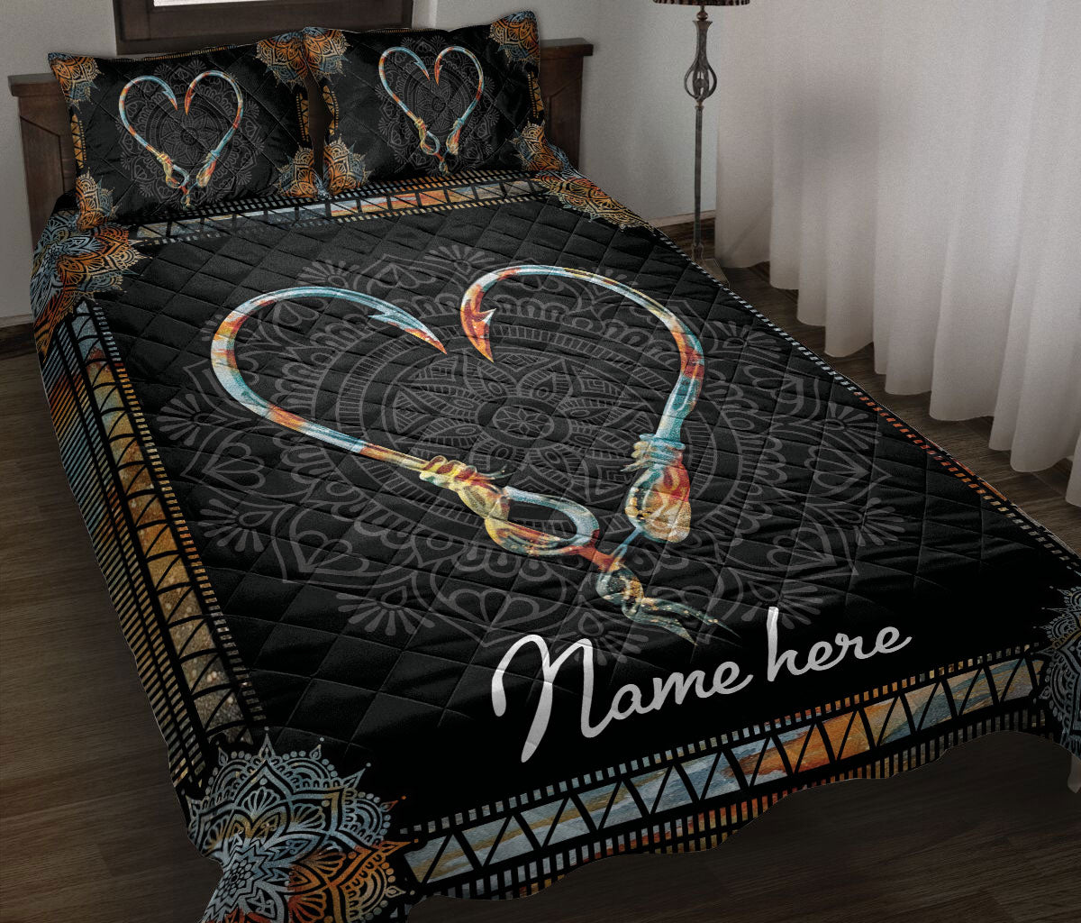 Black fishing quilt blanket displayed on a bed with heart-shaped hooks and ornate copper and teal borders
