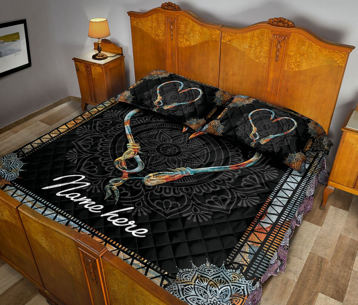 Fishing hook heart quilt blanket styled across a wooden bedroom with matching patterned pillows