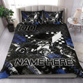 Dirt track racing quilt blanket styled in a bedroom with sprint car and checkered flag artwork